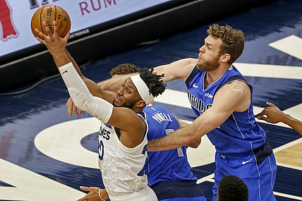 May 16, 2021; Minneapolis, Minnesota, USA; Minnesota Timberwolves forward Josh Okogie (20) grabs a rebound as Dallas Mavericks forward Nicolo Melli (44) defends in the first quarter at Target Center. Mandatory Credit: Bruce Kluckhohn-USA TODAY Sports