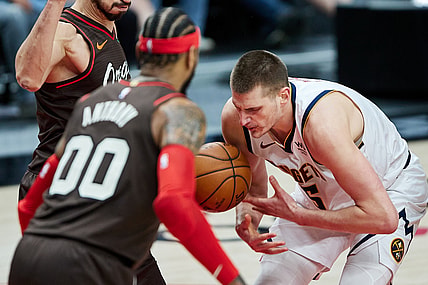 May 16, 2021; Portland, Oregon, USA;  Denver Nuggets center Nikola Jokic (15) loses the ball against the Portland Trail Blazers during the second quarter at the Moda Center. Mandatory Credit: Craig Mitchelldyer-USA TODAY Sports