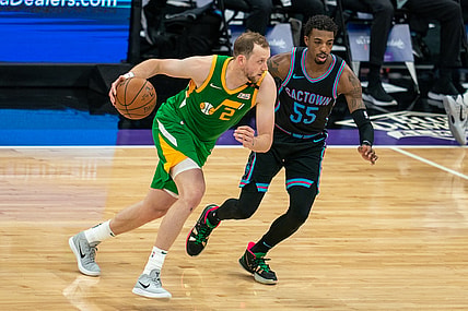 May 16, 2021; Sacramento, California, USA;  Utah Jazz guard Joe Ingles (2) drives in against Sacramento Kings guard Delon Wright (55) during the second quarter at Golden 1 Center. Mandatory Credit: Neville E. Guard-USA TODAY Sports