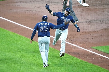May 18, 2021; Baltimore, Maryland, USA; Tampa Bay Rays catcher Mike Zunino (10) is greeted by third base coach Rodney Linares (27) following his two run home run in the third inning against the Baltimore Orioles at Oriole Park at Camden Yards. Mandatory Credit: Mitch Stringer-USA TODAY Sports