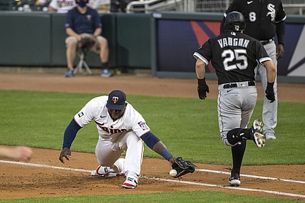 May 18, 2021; Minneapolis, Minnesota, USA; Chicago White Sox first baseman Andrew Vaughn (25) reaches first base before Minnesota Twins first baseman Miguel Sano (22) can catch the ball in the second inning at Target Field. Mandatory Credit: Jesse Johnson-USA TODAY Sports