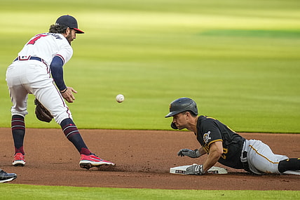 May 20, 2021; Cumberland, Georgia, USA; Pittsburgh Pirates second baseman Adam Frazier (26) slides into second base after hitting a double against the Atlanta Braves during the first inning at Truist Park. Mandatory Credit: Dale Zanine-USA TODAY Sports