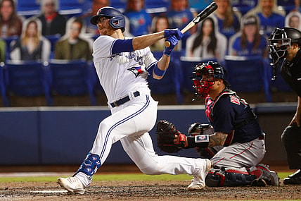 May 20, 2021; Dunedin, Florida, CAN; Toronto Blue Jays catcher Danny Jansen (9) hits a double during the sixth inning agains the Boston Red Sox at TD Ballpark. Mandatory Credit: Nathan Ray Seebeck-USA TODAY Sports