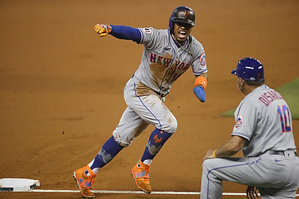 May 21, 2021; Miami, Florida, USA; New York Mets shortstop Francisco Lindor (12) reacts after Miami Marlins third baseman Brian Anderson (15) looses the baseball during the first inning at loanDepot Park. Mandatory Credit: Sam Navarro-USA TODAY Sports