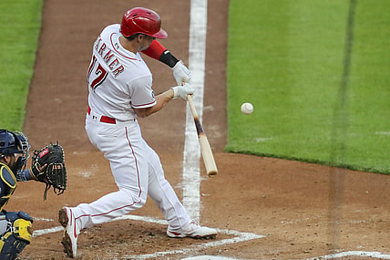 May 21, 2021; Cincinnati, Ohio, USA; Cincinnati Reds shortstop Kyle Farmer (17) hits against the Milwaukee Brewers during the second inning at Great American Ball Park. Mandatory Credit: Katie Stratman-USA TODAY Sports