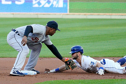 May 21, 2021; Kansas City, Missouri, USA; Kansas City Royals left fielder Andrew Benintendi (16) is tagged out by Detroit Tigers second baseman Jonathan Schoop (7) at second base trying to advance on a single during the first inning at Kauffman Stadium. Mandatory Credit: Denny Medley-USA TODAY Sports