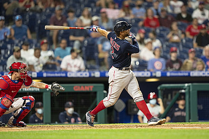 May 21, 2021; Philadelphia, Pennsylvania, USA; Boston Red Sox shortstop Xander Bogaerts (2) hits a single during the fifth inning against the Philadelphia Phillies at Citizens Bank Park. Mandatory Credit: Gregory Fisher-USA TODAY Sports