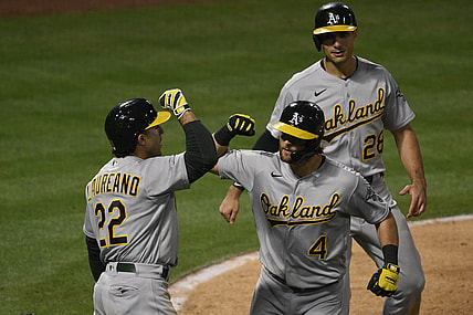 May 21, 2021; Anaheim, California, USA; Oakland Athletics second baseman Chad Pinder (4) celebrates with center fielder Ramon Laureano (22) after a three-run home run during the seventh inning against the Los Angeles Angels at Angel Stadium. Mandatory Credit: Kelvin Kuo-USA TODAY Sports