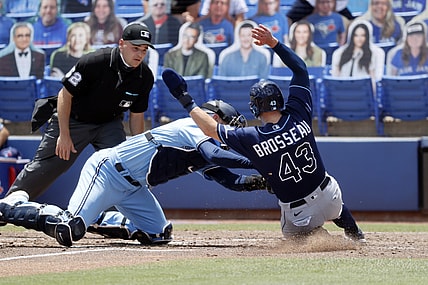 May 23, 2021; Dunedin, Florida, CAN;  Toronto Blue Jays catcher Danny Jansen (9) tags out Tampa Bay Rays third baseman Mike Brosseau (43) at home plate during the fourth inning at TD Ballpark. Mandatory Credit: Kim Klement-USA TODAY Sports