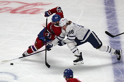 May 24, 2021; Montreal, Quebec, CAN; Toronto Maple Leafs center William Nylander (88) and Montreal Canadiens defenseman Ben Chiarot (8) battle for the puck during the first period of the game three of the first round of the 2021 Stanley Cup Playoffs at Bell Centre. Mandatory Credit: Jean-Yves Ahern-USA TODAY Sports