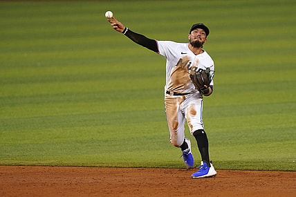 May 24, 2021; Miami, Florida, USA; Miami Marlins shortstop Miguel Rojas (19) throws out Philadelphia Phillies third baseman Alec Bohm (28, not pictured) in the 3rd inning at loanDepot park. Mandatory Credit: Jasen Vinlove-USA TODAY Sports