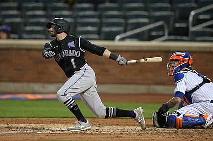 May 24, 2021; New York City, New York, USA; Colorado Rockies center fielder Garrett Hampson (1) follows through on an RBI triple against the New York Mets during the fourth inning at Citi Field. Mandatory Credit: Brad Penner-USA TODAY Sports