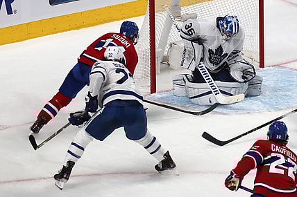 May 24, 2021; Montreal, Quebec, CAN; Toronto Maple Leafs goaltender Jack Campbell (36) makes a save against Montreal Canadiens center Nick Suzuki (14) during the third period of the game three of the first round of the 2021 Stanley Cup Playoffs at Bell Centre. Mandatory Credit: Jean-Yves Ahern-USA TODAY Sports
