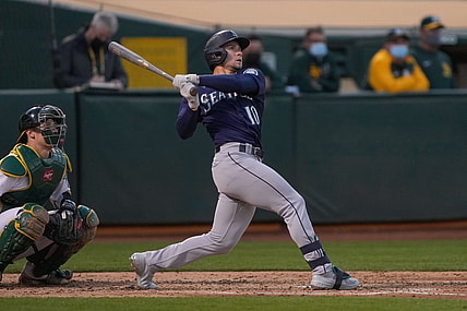 May 24, 2021; Oakland, California, USA;  Seattle Mariners center fielder Jarred Kelenic (10) hits a solo home run against the Oakland Athletics during the fifth inning at RingCentral Coliseum. Mandatory Credit: Stan Szeto-USA TODAY Sports