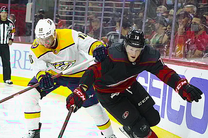 May 25, 2021; Raleigh, North Carolina, USA; Carolina Hurricanes left wing Steven Lorentz (78) and Nashville Predators center Colton Sissons (10) battle during the third period in game five of the first round of the 2021 Stanley Cup Playoffs at PNC Arena. Mandatory Credit: James Guillory-USA TODAY Sports
