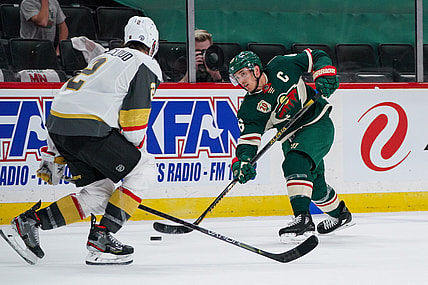 May 26, 2021; Saint Paul, Minnesota, USA; Minnesota Wild defenseman Jared Spurgeon (46) shoots against Vegas Golden Knights defenseman Zach Whitecloud (2) in the second period in game six of the first round of the 2021 Stanley Cup Playoffs at Xcel Energy Center. Mandatory Credit: Brad Rempel-USA TODAY Sports