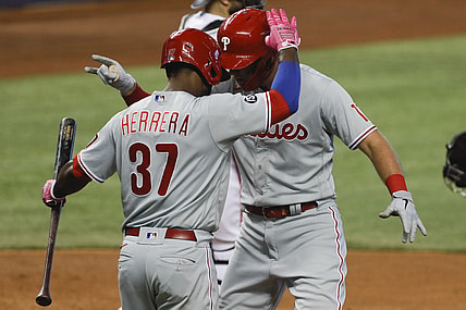 May 27, 2021; Miami, Florida, USA; Philadelphia Phillies first baseman Rhys Hoskins (17) celebrates with center fielder Odubel Herrera (37) after scoring against the Miami Marlins during the fourth inning at loanDepot Park. Mandatory Credit: Sam Navarro-USA TODAY Sports