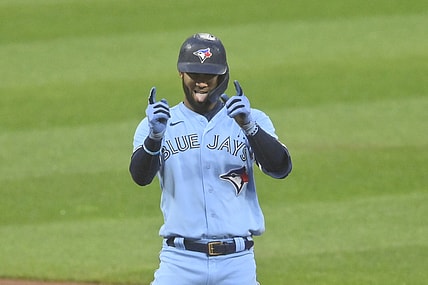 May 28, 2021; Cleveland, Ohio, USA; Toronto Blue Jays left fielder Lourdes Gurriel Jr. (13) celebrates his RBI double during the third inning against the Cleveland Indians at Progressive Field. Mandatory Credit: David Richard-USA TODAY
