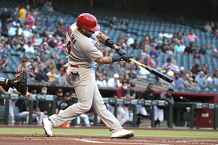 May 28, 2021; Phoenix, Arizona, USA; St. Louis Cardinals catcher Yadier Molina (4) hits an RBI double against the Arizona Diamondbacks in the first inning at Chase Field. Mandatory Credit: Rick Scuteri-USA TODAY Sports