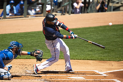 May 29, 2021; Minneapolis, Minnesota, USA; Minnesota Twins designated hitter Nelson Cruz (23) hits an RBI ground rule double during the first inning against the Kansas City Royals at Target Field. Mandatory Credit: Jordan Johnson-USA TODAY Sports