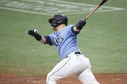 May 30, 2021; St. Petersburg, Florida, USA; Tampa Bay Rays catcher Mike Zunino (10) hits a home run during the second inning against the Philadelphia Phillies at Tropicana Field. Mandatory Credit: Kim Klement-USA TODAY Sports