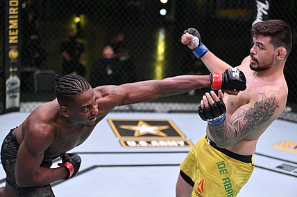 May 30, 2020; Las Vegas, NV, USA; Jamahal Hill (red gloves) punches Klidson Abreu of Brazil (blue gloves) in their light heavyweight fight during UFC Fight Night.  Mandatory Credit: Jeff Bottari/Zuffa via USA TODAY Sports