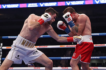 Dec 19, 2020; San Antonio, TX, USA;   Canelo Alvarez (red trunks) and Callum Smith (white trunks) during their WBA, WBC and Ring Magazine super middleweight championship bout at the Alamodome in San Antonio, TX. Mandatory Credit: Ed Mulholland/Handout Photo via USA TODAY Sports