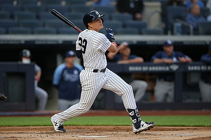Jun 2, 2021; Bronx, New York, USA; New York Yankees third baseman Gio Urshela (29) follows through on a two run home run against the Tampa Bay Rays during the first inning at Yankee Stadium. Mandatory Credit: Brad Penner-USA TODAY Sports