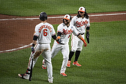 Jun 2, 2021; Baltimore, Maryland, USA;  Baltimore Orioles right fielder DJ Stewart (24) celebrate with third baseman Ryan Mountcastle (6) after hitting a two hun home run scoring  shortstop Freddy Galvis (2) in the fifth inning against the Minnesota Twins at Oriole Park at Camden Yards. Mandatory Credit: Tommy Gilligan-USA TODAY Sports