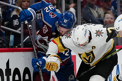 Jun 2, 2021; Denver, Colorado, USA; Vegas Golden Knights defenseman Alex Pietrangelo (7) hits Colorado Avalanche left wing Gabriel Landeskog (92) in the third period in game two of the second round of the 2021 Stanley Cup Playoffs at Ball Arena. Mandatory Credit: Ron Chenoy-USA TODAY Sports
