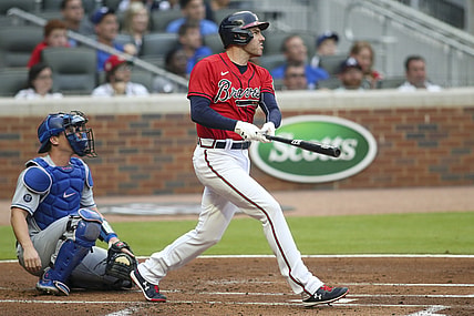 Jun 4, 2021; Atlanta, Georgia, USA;  Atlanta Braves first baseman Freddie Freeman (5) hits a home run against the Los Angeles Dodgers in the first inning at Truist Park. Mandatory Credit: Brett Davis-USA TODAY Sports