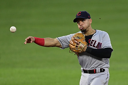 Jun 4, 2021; Baltimore, Maryland, USA;  Cleveland Indians second baseman Cesar Hernandez (7) throws to first base to end the third inning against the Baltimore Orioles at Oriole Park at Camden Yards. Mandatory Credit: Tommy Gilligan-USA TODAY Sports