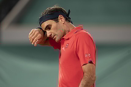 Jun 5, 2021; Paris, France; Roger Federer (SUI) wipes his brow during his match against Dominik Koepfer (GER) on day seven of the French Open at Stade Roland Garros. Mandatory Credit: Susan Mullane-USA TODAY Sports