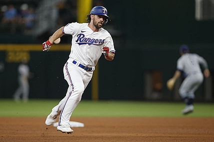 Jun 5, 2021; Arlington, Texas, USA; Texas Rangers third baseman Charlie Culberson (2) runs to third base after hitting a triple during the fifth inning against the Tampa Bay Rays at Globe Life Field. Mandatory Credit: Tim Heitman-USA TODAY Sports
