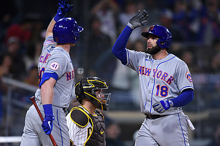 Jun 5, 2021; San Diego, California, USA; New York Mets second baseman Jose Peraza (18) is congratulated by right fielder Billy McKinney (left) after hitting a home run against the San Diego Padres during the fifth inning at Petco Park. Mandatory Credit: Orlando Ramirez-USA TODAY Sports