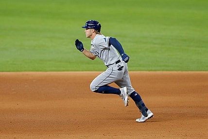 Jun 6, 2021; Arlington, Texas, USA; Tampa Bay Rays shortstop Taylor Walls (6) hits a 2-run go ahead double during the eighth inning against the Texas Rangers at Globe Life Field. Mandatory Credit: Andrew Dieb-USA TODAY Sports