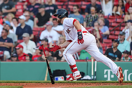 Jun 7, 2021; Boston, Massachusetts, USA; Boston Red Sox second baseman Christian Arroyo (39) hits a RBI single during the fourth inning against the Miami Marlins at Fenway Park. Mandatory Credit: Paul Rutherford-USA TODAY Sports