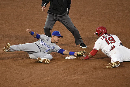 Jun 7, 2021; Anaheim, California, USA; Los Angeles Angels center fielder Juan Lagares (19) steals second base against Kansas City Royals shortstop Nicky Lopez (8) during the fourth inning at Angel Stadium. Mandatory Credit: Kelvin Kuo-USA TODAY Sports