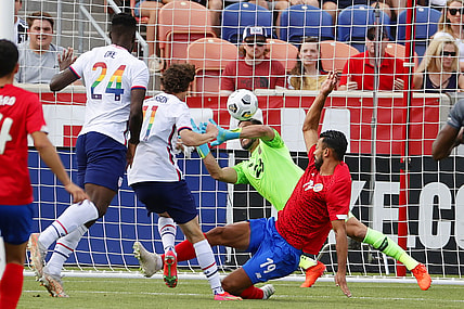 Jun 9, 2021; Sandy, Utah, USA; United State forward Brenden Aaronson (11) shoots for a goal in the first half on Costa Rica goalkeeper Leonel Moreira (23) during an international friendly soccer match at Rio Tinto Stadium. Mandatory Credit: Jeffrey Swinger-USA TODAY Sports