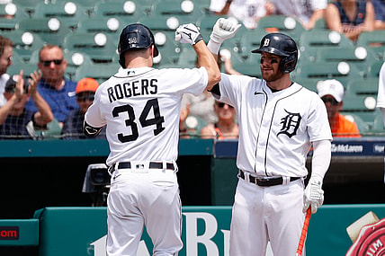 Jun 10, 2021; Detroit, Michigan, USA;  Detroit Tigers catcher Jake Rogers (34) receives congratulations from left fielder Robbie Grossman (8) after he hits a home run in the second inning against the Seattle Mariners at Comerica Park. Mandatory Credit: Rick Osentoski-USA TODAY Sports
