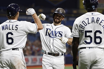 Jun 11, 2021; St. Petersburg, Florida, USA; Tampa Bay Rays second baseman Brandon Lowe (8) is congratulated after scoring a run during the fourth inning against the Baltimore Orioles at Tropicana Field. Mandatory Credit: Kim Klement-USA TODAY Sports