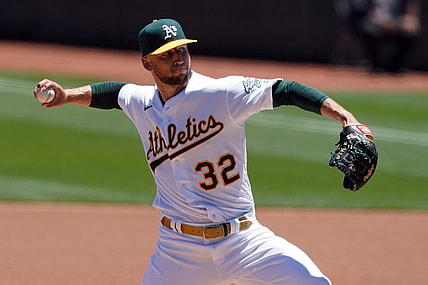 Jun 12, 2021; Oakland, California, USA; Oakland Athletics starting pitcher James Kaprielian (32) throws a pitch during the first inning against the Kansas City Royals at RingCentral Coliseum. Mandatory Credit: Darren Yamashita-USA TODAY Sports