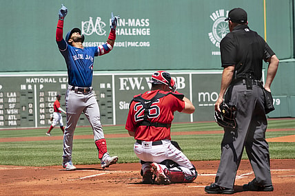 Jun 13, 2021; Boston, Massachusetts, USA; Toronto Blue Jays left fielder Lourdes Gurriel Jr. (13) reacts to hitting a home run as he approaches home plate during the first inning against the Boston Red Sox at Fenway Park. Mandatory Credit: Gregory Fisher-USA TODAY Sports