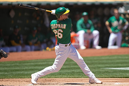 Jun 13, 2021; Oakland, California, USA;  Oakland Athletics third baseman Matt Chapman (26) hits a solo home run during the first inning against the Kansas City Royals at RingCentral Coliseum. Mandatory Credit: Stan Szeto-USA TODAY Sports