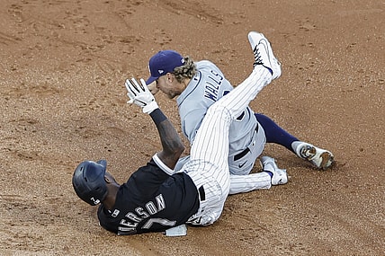 Jun 14, 2021; Chicago, Illinois, USA; Chicago White Sox shortstop Tim Anderson (7) is safe at second base after hitting a double as Tampa Bay Rays shortstop Taylor Walls (6) applies a late tag during the third inning at Guaranteed Rate Field. Mandatory Credit: Kamil Krzaczynski-USA TODAY Sports
