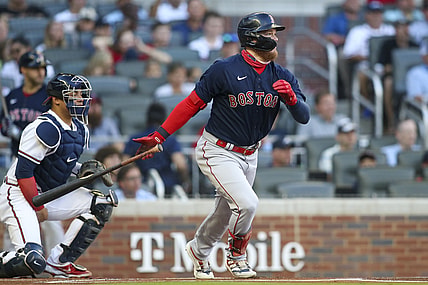 Jun 15, 2021; Atlanta, Georgia, USA; Boston Red Sox center fielder Alex Verdugo (99) hits a single against the Atlanta Braves in the first inning at Truist Park. Mandatory Credit: Brett Davis-USA TODAY Sports
