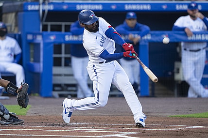 Jun 15, 2021; Buffalo, New York, CAN; Toronto Blue Jays right fielder Teoscar Hernandez (37) hits a sacrifice fly ball to drive in a run during the first inning against the New York Yankees at Sahlen Field. Mandatory Credit: Gregory Fisher-USA TODAY Sports