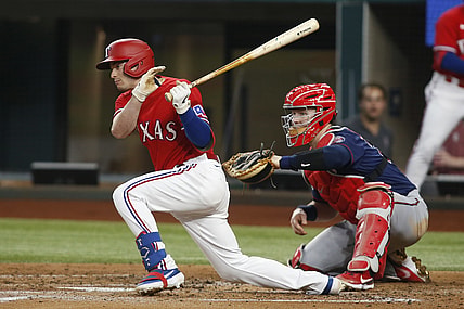 Jun 18, 2021; Arlington, Texas, USA; Texas Rangers second baseman Nick Solak (15) singles in a run in the first inning against the Minnesota Twins at Globe Life Field. Mandatory Credit: Tim Heitman-USA TODAY Sports