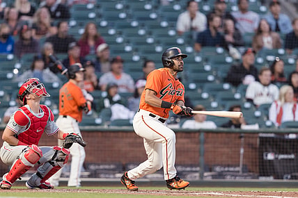 Jun 18, 2021; San Francisco, California, USA; San Francisco Giants left fielder LaMonte Wade Jr (31) hits a RBI triple against the Philadelphia Phillies in the fourth inning at Oracle Park. Mandatory Credit: John Hefti-USA TODAY Sports