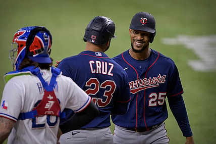 Jun 19, 2021; Arlington, Texas, USA; Minnesota Twins center fielder Byron Buxton (25) and designated hitter Nelson Cruz (23) celebrate Cruz hitting a two run home run against the Texas Rangers during the fourth inning at Globe Life Field. Mandatory Credit: Jerome Miron-USA TODAY Sports